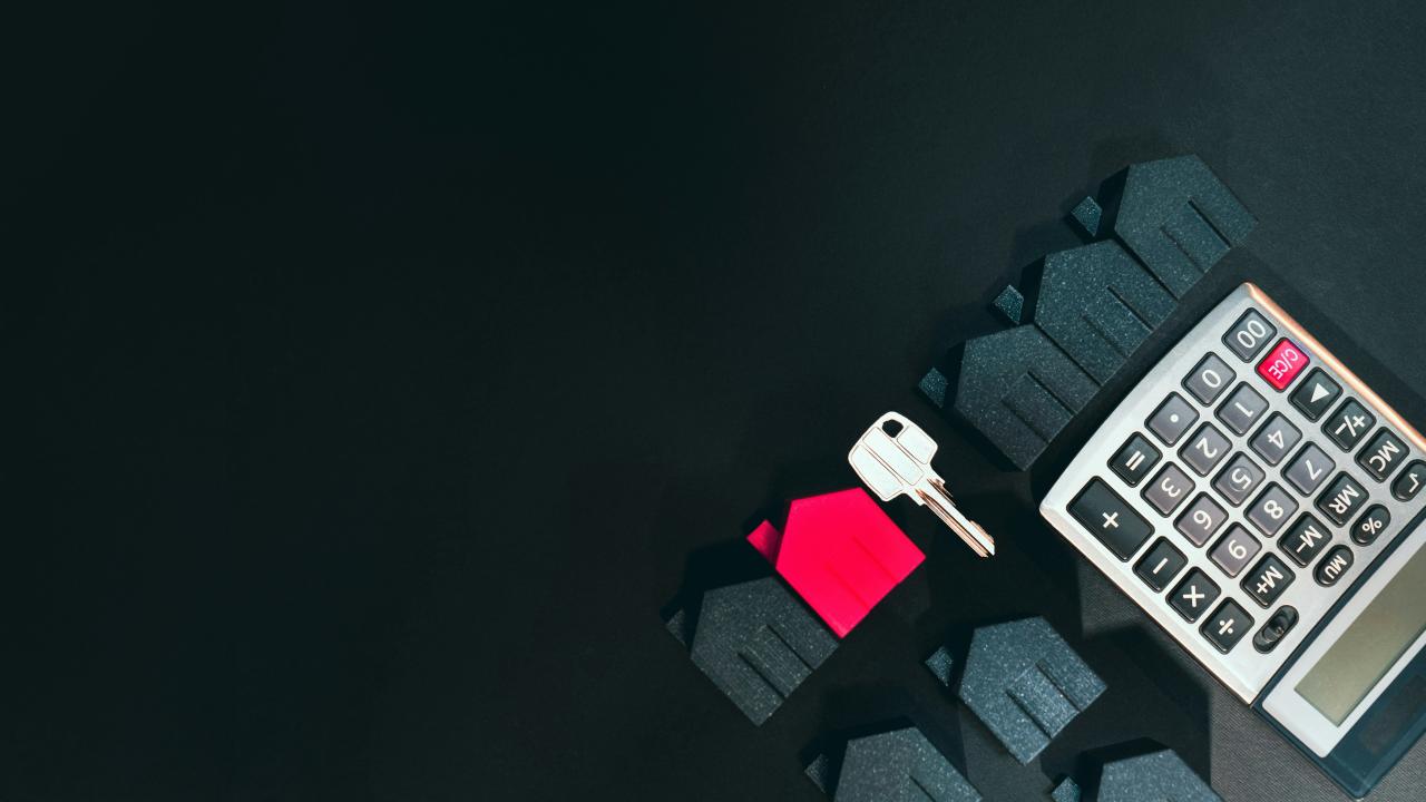 A cell phone sitting on top of a keyboard