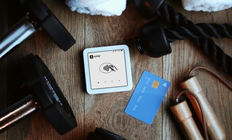 Fitness equipment beside a credit card reader and card.